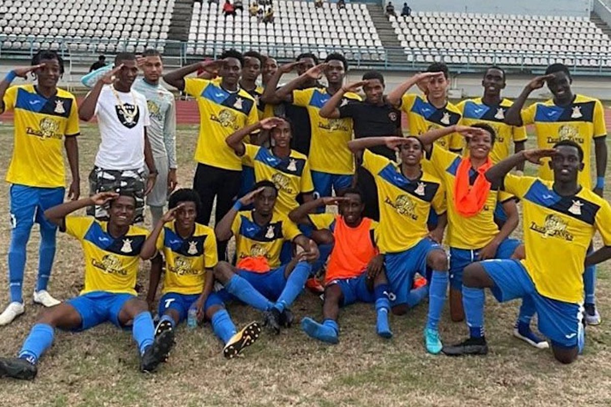 TRIUMPHANT: Members of the Defence Force Under-20 football team give the salute after they were crowned winners of the Tiger Tanks U-20 Football Tournament recently.