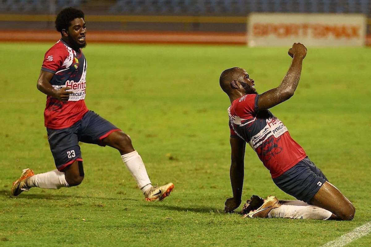 Point Fortin Civic FC's Andre Ettienne (right) celebrates after scoring the game-winning goal in a 4-3 victory over Defence Force at Hasely Crawford Stadium, Port of Spain on Saturday, March 16th 2024.
