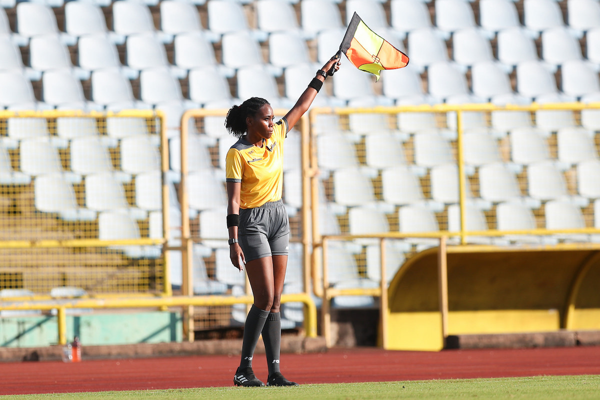 Assistant Referee raises her flag during an SSFL Premier Division semifinal between Fatima College and San Juan North Secondary at the Hasely Crawford Stadium on October 22nd 2022.