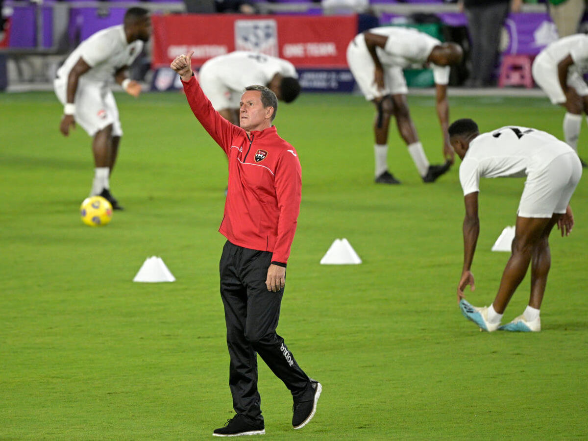 Trinidad and Tobago head coach Terry Fenwick acknowledges fans in the stands during warmups before an international friendly soccer match against the United States, Sunday, Jan. 31, 2021, in Orlando, Fla.  (Associated Press/Phelan M. Ebenhack)