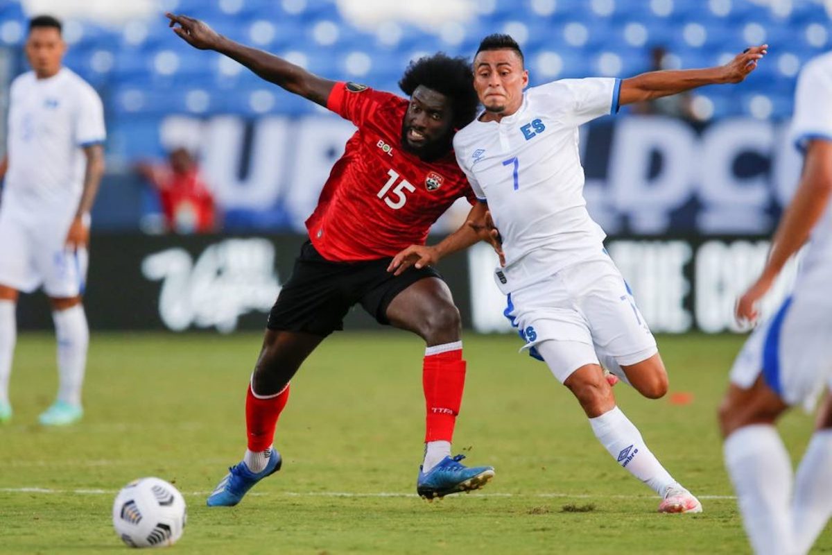 T&T midfielder Neveal Hackshaw (15) and El Salvador midfielder Darwin Ceren (7) battle for the ball during a 2021 Concacaf Gold Cup Group A match,on July 14, in Frisco, Texas. (AP Photo)