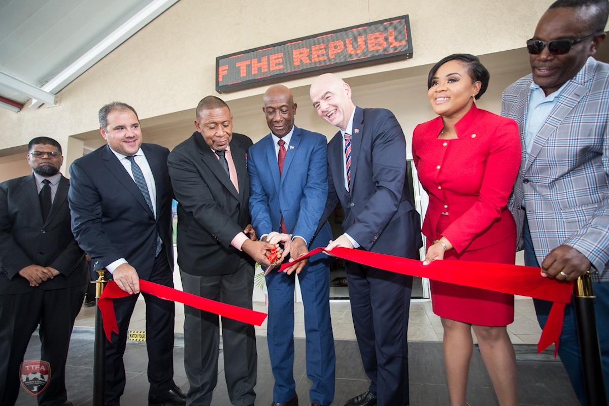 Former TTFA President David John-Williams (third from left) cuts the ribbon during the Grand Opening of the Hone of Football on November 18th 2019.