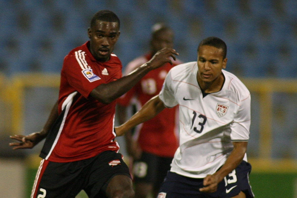 PORT OF SPAIN, TRINIDAD AND TOBAGO - SEPTEMBER 09: Clyde Leon (L) of Trinidad Tobago fights for the ball with Ricardo Clark of United States during their FIFA 2010 World Cup North, Central America and Caribbean qualifier at the Hasely Crawford Stadium on September 9, 2009 in Port Of Spain, Trinidad and Tobago. (Photo by Anthony Harris /LatinContent via Getty Images)