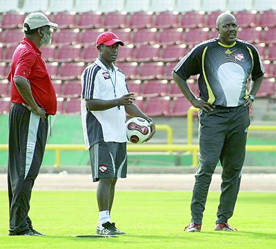 Technical director, Lincoln Phillips, left, national coach Russell Latapy, centre and goalkeeping coach, Michael Maurice, at a recent training session for the national football team. PHOTO: ANTHONY HARRIS