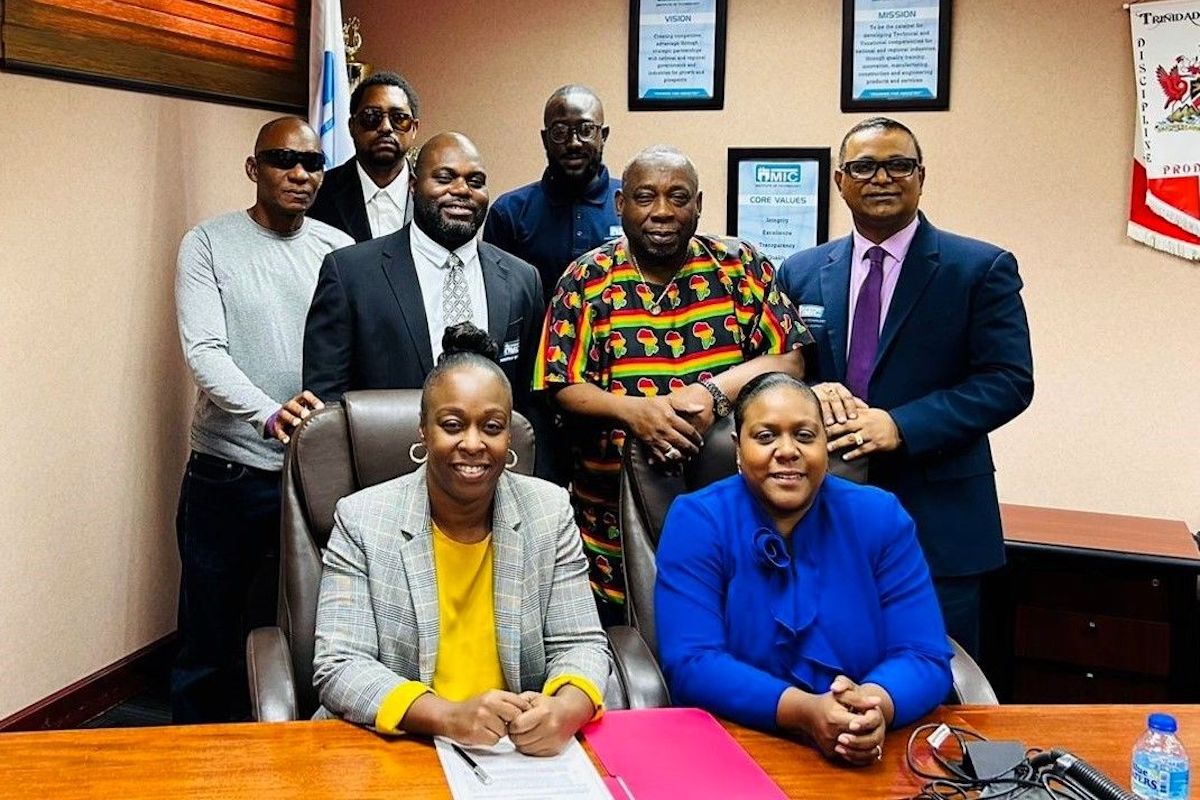This image dated 4 March 2024, shows MIC-IT and Matura Reunited FC executives present for the MOA Signing. From L to R: (Back row) Clinton Lewis, Assistant Coach; Dwain Henry, President, Matura Reunited FC; and Shem Alexander, Sports & Mentorship Coordinator, MIC-IT. (Middle row) Nathan Langaigne, General Manager (Ag), Training Division, MIC-IT; Clayton Blackman, Director, MIC-IT; and Anil Ramnarine, CEO, MIC-IT. (Front row) Neshon Frederick, General Manager Corporate Services (Ag.), MIC-IT; and Candice Austin, Assistant General Manager, Training Division, MIC-IT.