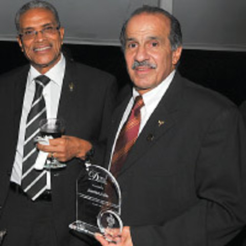 Former national football coach Hannibal Najjar, right, shares the moment with fellow alumni Dr Victor Coombs during the Distinguished Alumni Awards at the Teaching and Learning Complex, at UWIÂ’s St Augustine Campus