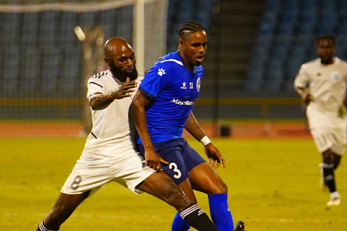 Police FC's Joevin Jones (#3) protects the ball while challenged by an Eagles FC player during a TTPFL match at Hasely Crawford Stadium, Port of Spain on Friday, November 24th 2023.