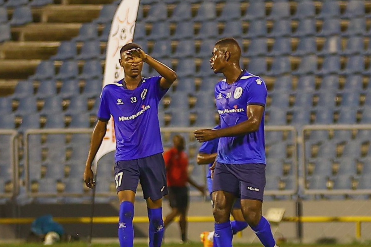 Police FC's Kareem Freitas (right) is congratulated by a teammate after scoring in his team’s 2-1 win over Morvant Caledonia at the Hasely Crawford Stadium, Mucurapo on Wednesday, April 3rd 2024.