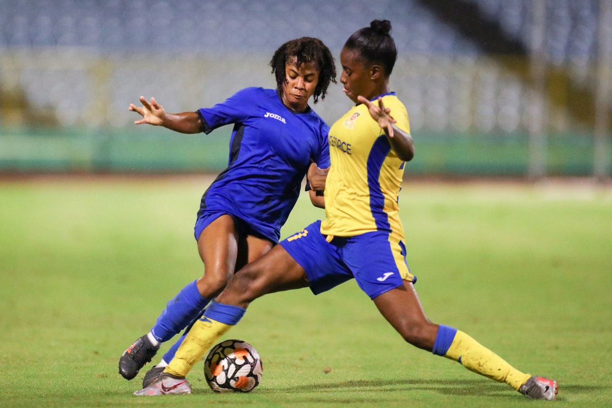 Police FC winger Shurella Mendez, left, dribbles Defence Force defender Kamile Degale, right, during the TTWoLF Ascension League match at the Hasely Crawford Stadium in Port-of-Spain on Wednesday, September 21st 2022. Mendez scored a double for Police FC in their 3-2 win. (Photo by Daniel Prentice)