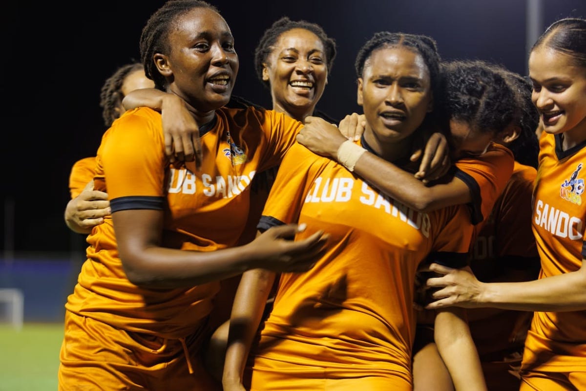 Club Sando's Dennecia Prince (left) celebrates with Afiyah Cornwall (center) after a goal during the TTWolf final against AC Port of Spain at Hasely Crawford Stadium, Mucurapo on Wednesday, December 13th 2023.