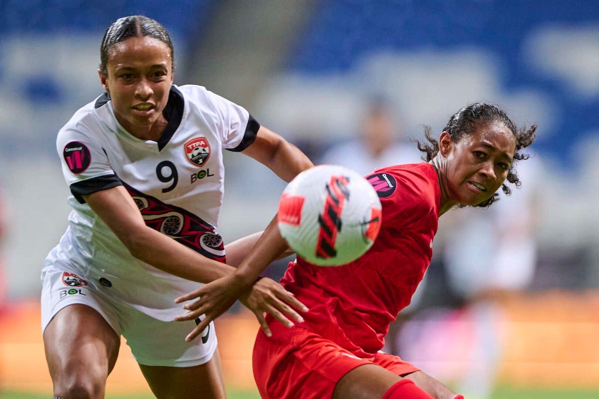 Trinidad and Tobago's Brianna Austin (#9) challenges dir the ball during a Group B match against Canada at the 2022 CONCACAF Women's Championship at the BBVA Stadium in Monterrey, Mexico on Tuesday, July 5th 2022.