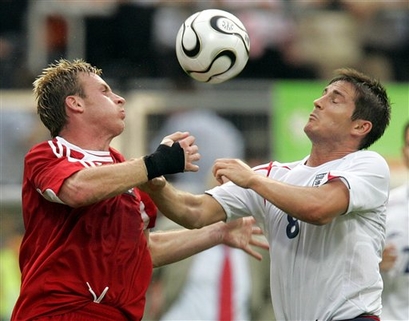 Chris Birchall goes up against England's Frank Lampard.