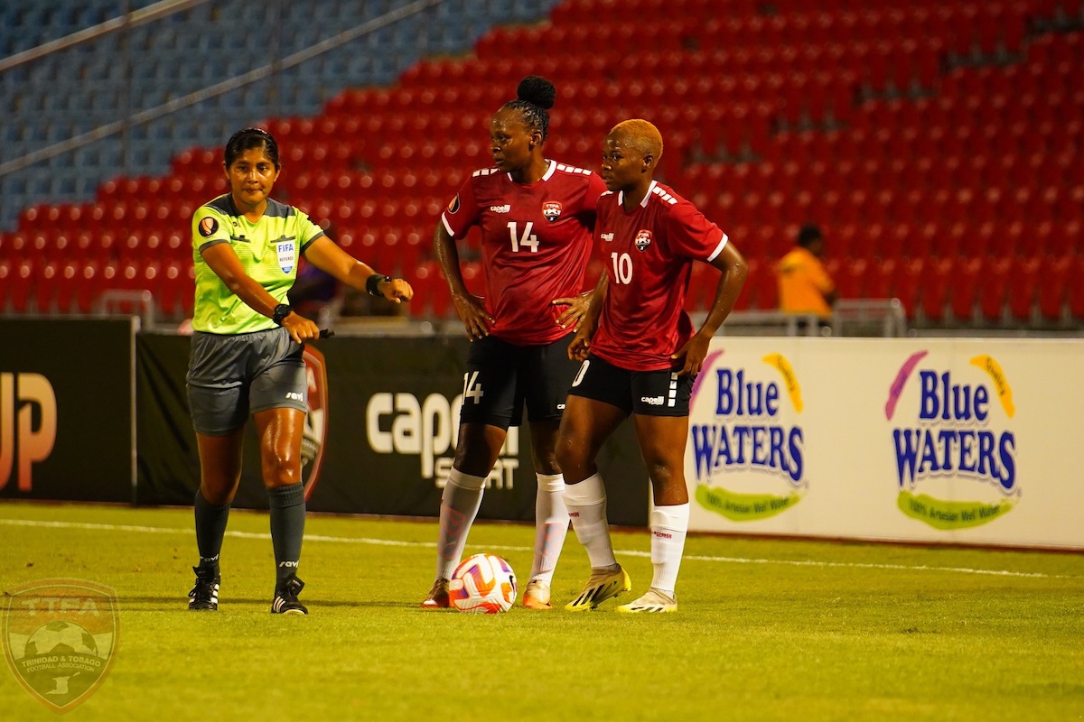 Trinidad and Tobago Women's captain Karyn Forbes (#14) and midfielder Asha James (#10) stand over a free kick during a Road to W Gold Cup match against Puerto Rico at the Hasely Crawford Stadium, Port of Spain on October 27th 2023.