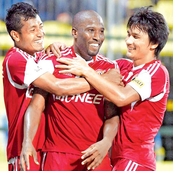 Lajong’s Cornell Glen celebrates with his teammates after one of his two goals against Mumbai.