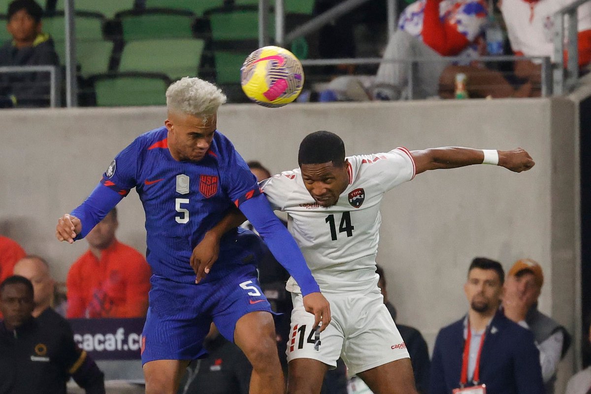 Antonee Robinson #5 of U.S. Men's National Team goes against Shannon Gomez #14 of Trinidad and Tobago on a head in the first half during the CONCACAF Nations League Quarterfinal Round leg 1 match at Q2 stadium on November 16, 2023 in Austin, Texas. (Photo by Ronald Cortes/Getty Images)