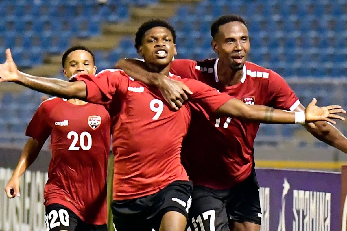 Trinidad and Tobago's midfielder #09 Nathaniel James (C) celebrates scoring his team's third goal with teammates defender #17 Justin Garcia (R) and midfielder #20 Kaile Auvray (L) during the CONCACAF Nations League group A football match between Trinidad and Tobago and Guatemala at Hasely Crawford stadium in Port of Spain, Trinidad and Tobago on October 13, 2023. (Photo by Robert TAYLOR / AFP) (Photo by ROBERT TAYLOR/AFP via Getty Images)