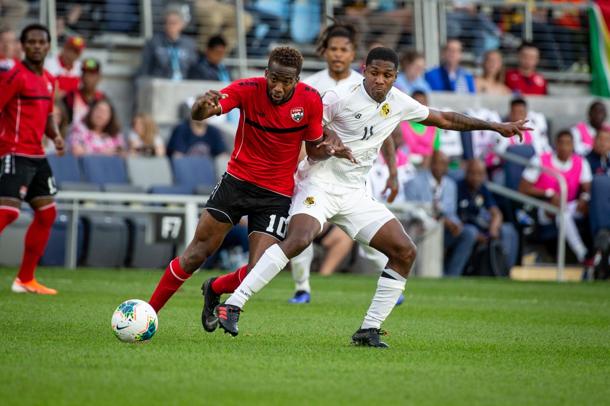 Jun 18, 2019; Saint Paul, MN, USA; Panama midfielder Armando Cooper (11) trips Trinidad and Tobago midfielder Kevin Molino (10) during group play in the CONCACAF Gold Cup soccer tournament at Allianz Field. PHOTO: Bruce Kluckhohn-USA TODAY Sports