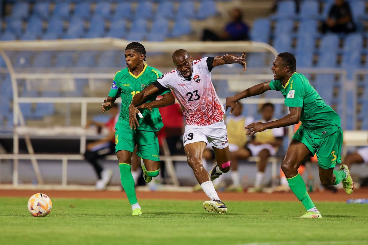Trinidad and Tobago’s Kevon “Showtime” Woodley, centre, tries to get past Guyana’s Kevin Layne, right, and Nicholai Andrews during a friendly match at the Hasely Crawford Stadium in Mucurapo, Port-of-Spain, on May 15th 2024. PHOTO BY: Daniel Prentice