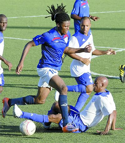 WASA’s Kerron Smith, left, attempts to go past the sliding tackle of Real Maracas’ Kester Mejias in their Emerald Apartments & Plaza Eastern Football Association League Cup final at Marvin Lee Stadium, Macoya, on Sunday. WASA won 1-0. ...Photo: Anthony Harris