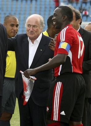 Yorke shakes hands with Blatter.