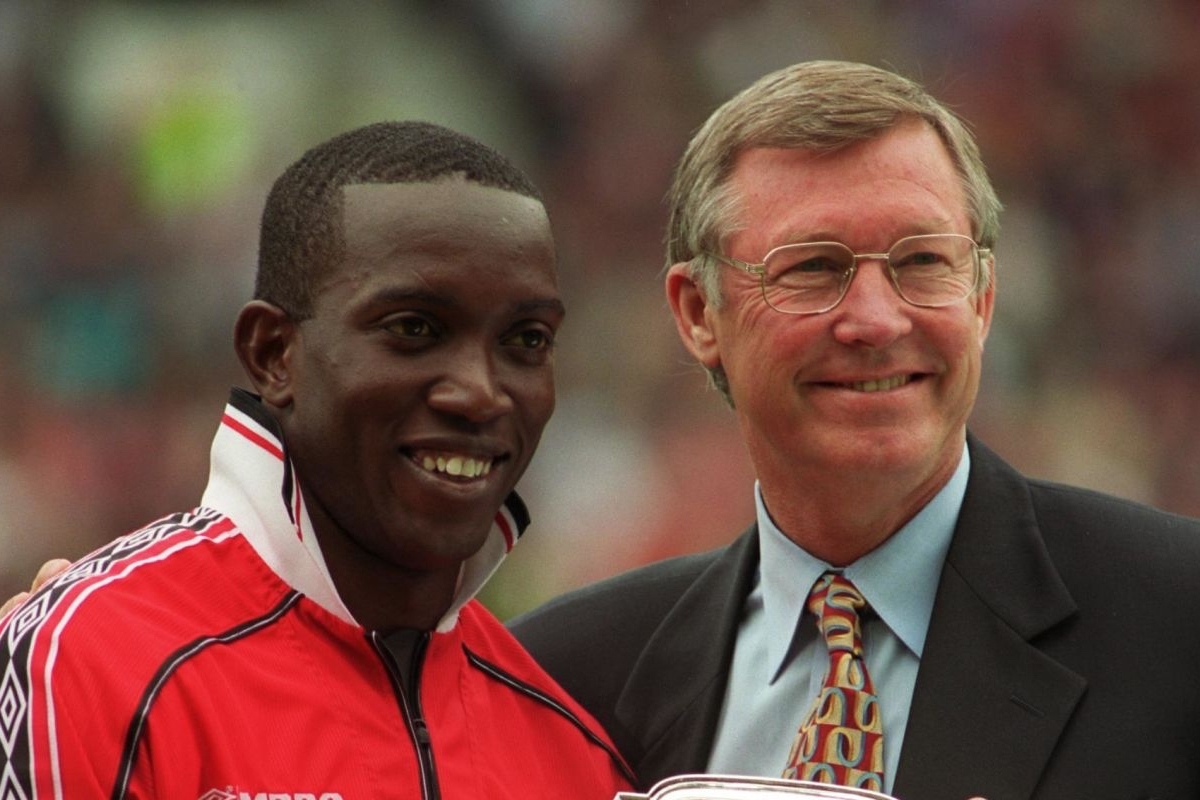Manchester United manager Alex Ferguson (right) presents Dwight Yorke (left) with the club's Player of the Year award (Photo by Neal Simpson/EMPICS via Getty Images)
