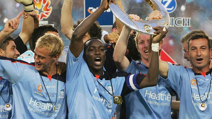 Dwight Yorke celebrates with Sydney FC teammates after winning the A-League championship